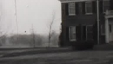 Beachwood New Jersey USA (1937): A Smiling Woman Walks Down Porch Steps While