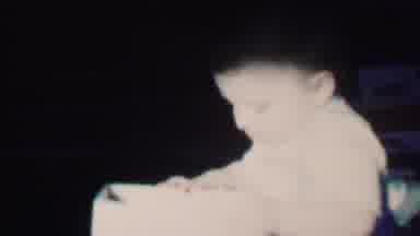 Des Moines Iowa USA (1959): Baby Sitting On A Bed Picking Up A Block And Then