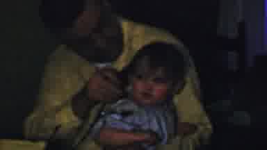Des Moines Iowa USA (1959): Child Squirming In The Arms Of A Man But Is Calm When