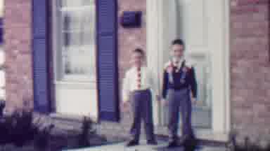Grand Rapids Michigan USA (1958): Two Boys Walk Together In Front Of A House