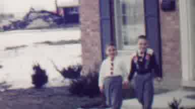 Grand Rapids Michigan USA (1958): Two Boys Walking Hand In Hand From The Front