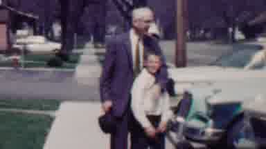 Grand Rapids Michigan USA (1958): Grandpa Puts His Hat On Grandson While Grandma