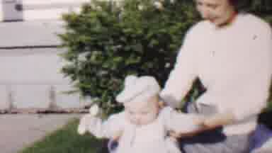 Lincoln Nebraska USA-1962: Mother And Child Sitting In The Grass Baby Playing