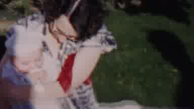 Lincoln Nebraska USA (1962): Family Passes Around Small Baby On Their Front Lawn