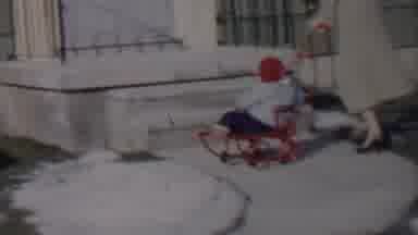 Lincoln Nebraska USA (1962): A Lady Pushing A Child And Another Kid Walks Up.