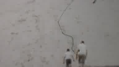 Louisiana USA (1959): Male Adult And Child Walking On Sand