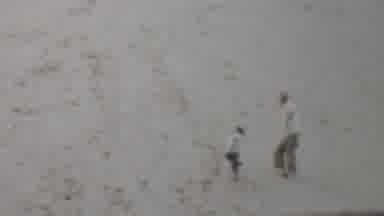Louisiana USA (1959): A Man And A Boy Climb Up A White Hill And Turn To Wave