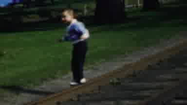 Louisiana USA (1959): Boy Playing On Railroad Tracks With Blue Pant Blue Jacke.