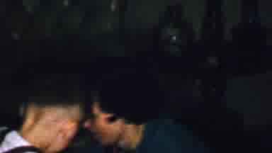 Omaha Nebraska USA (1959): Woman Helps Two Young Boys Open Christmas Gifts On The