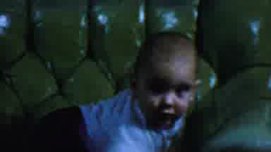 Omaha Nebraska USA (1959): Baby Brother Fidgeting Around On Couch During Photo