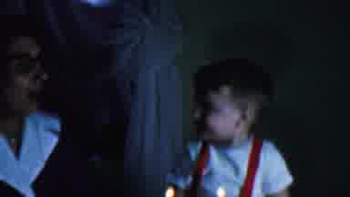 Omaha Nebraska USA (1959): A Woman Is Teachng A Baby How To Blow A Candle And Baby