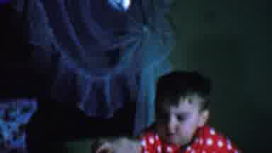 OMAHA NEBRASKA USA-1959: Small Child Lifting Large Multi-Colored Spinner To Face