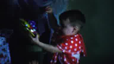Omaha Nebraska USA (1959): Toddler Gives Spinning Top To Adult