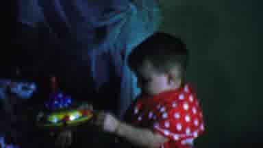 Omaha Nebraska USA (1959): Young Child Playing With Multicolored Spinning Toy And