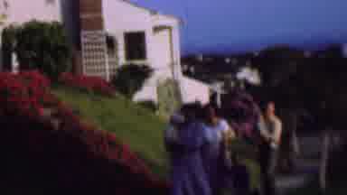 San Diego California USA-1961: Family Walk on Hillside with Flowers and House
