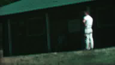 FARRAGUT STATE PARK IDAHO USA-1967: Man in White Near Cabin with Classic Car in Background