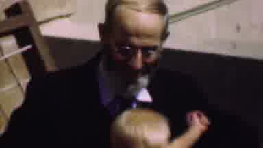 San Diego California USA (1961): A Grandfather Holding His Grandchild In His Lap