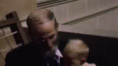 San Diego California USA (1961): Older Man With Beard Holding Baby