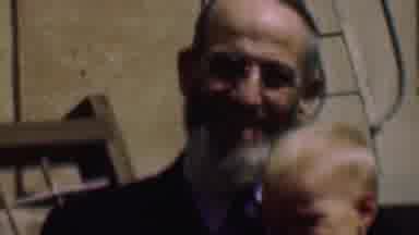 San Diego California USA (1961): Boy Sits On Old Man's Lap