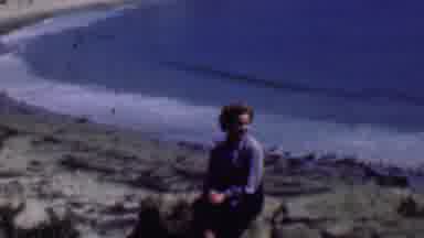 San Diego California USA (1961): Woman Sitting On A Rock Next To A Beach At The