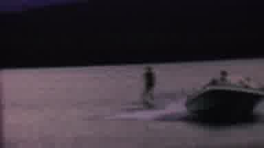 St Paul Minnesota USA (1962): Man Water Skiing Around Lake Being Tugged By