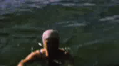 St Paul Minnesota USA (1962): Woman Swimming In A Lake Surrounded By A Beautiful
