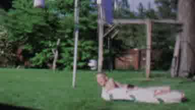 ST PAUL MINNESOTA USA-1962: Boy Playing In Backyard With Wooden Play Structure