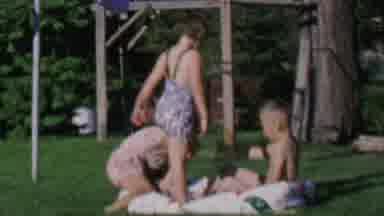 St Paul Minnesota USA (1962): Children In Bathing Suits Playing In A Plastic