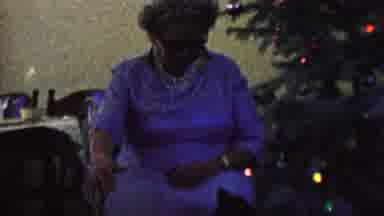ST PAUL MINNESOTA USA-1962: Elderly Woman In Blue Dress Sitting In Chair By Christmas Tree