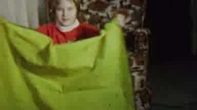 St Paul Minnesota USA (1962): A Kid In Red Clothes Holding A Green Blanket