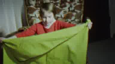 St Paul Minnesota USA (1962): A Child Holding What Appears To Be A Blanket Inside