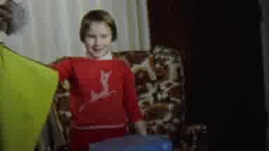 St Paul Minnesota USA (1962): A Little Girl In A Red Sweater Holding Open A Green