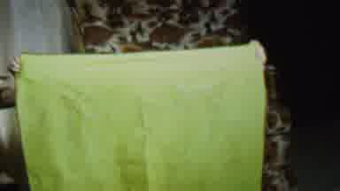 St Paul Minnesota USA (1962): Boy Holding Up A Large Yellow Blanket Then Drops It