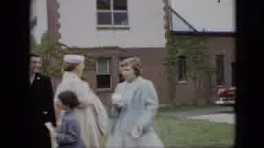 Pennsylvania (1957): Formally Dressed People Outside Building