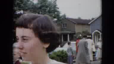 Pennsylvania (1957): People Dressed In Formal Wear Socialize In A Yard In A