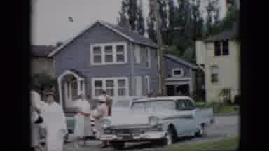 Pennsylvania (1957): Group Of Men And Women On Busy Street In Front Of House