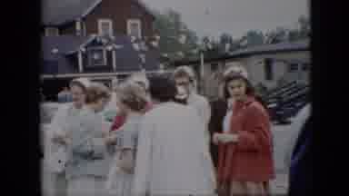 Pennsylvania (1957): A Crowd Of People Dressed In Formal Wear Stand Next To A Road