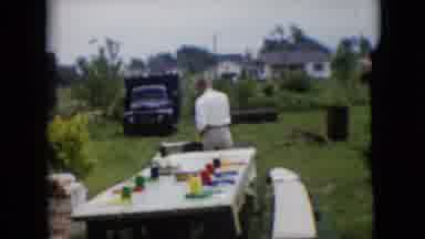 Pennsylvania (1957): Two Men Preparing For A Barbecue, One Of Them Lights A Flame.