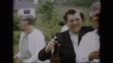Pennsylvania (1957): Cheering People Toast With Bottles Outdoors