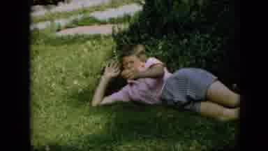 Pennsylvania (1957): Woman Laying On Grass As Older Woman Watches