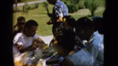 Pennsylvania (1957): A Group Of People Sitting Together And Eating A Picnic Meal