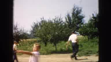 Pennsylvania (1957): Man, Woman, And Children Gather To Play Baseball In Rural
