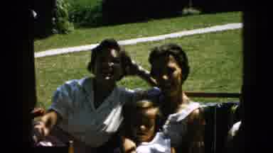 Pennsylvania (1957): Two Women And Two Children Rocking On A Porch Swing