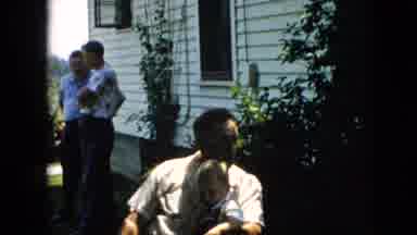 Pennsylvania (1957): A Family Is Hanging Out In A Backyard