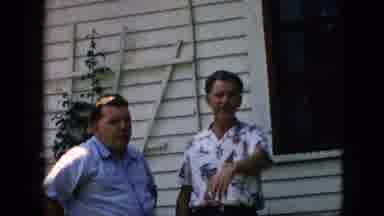 Pennsylvania (1957): Two Men Talking At A Picnic In A Backyard