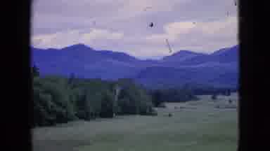 Niagra Falls New York (1964): Panned View Of A Golf Green Facing Distant Mountains