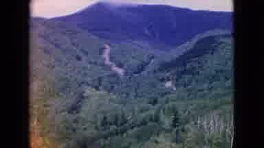 Niagra Falls New York (1964): Green Mountain With Sun Beaming Light