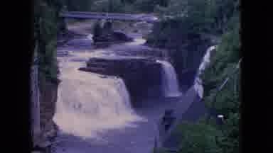 Niagra Falls New York (1964): Waterfall In The Midst Of Rocks And Trees And Above
