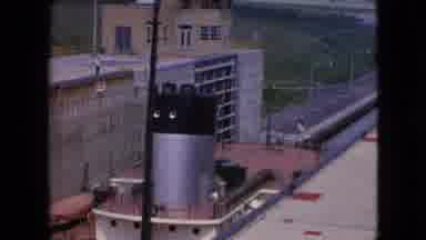 Niagra Falls New York-1964: Large Tug Boat Entering Canal Lock On A Summer Day