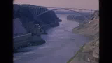Niagra Falls New York (1964): Water Flowing Down River Under A Bridge